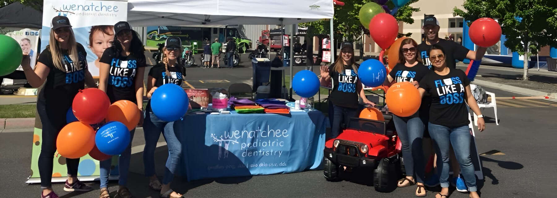 Cheerful group celebrates around decorated table at Wenatchee Washington